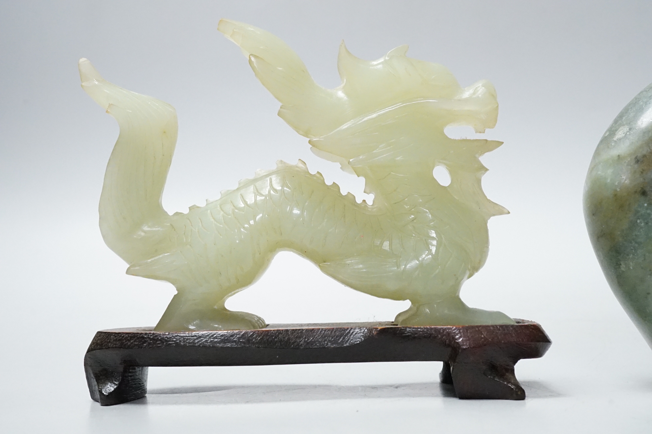 A Chinese bowenite dragon on stand and a soapstone carving, largest 12cm long